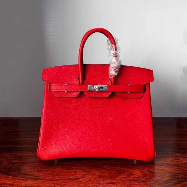 Birkin 25 Handcrafted Togo Leather in Ferrari Red with Silver Hardware Hand stitched Saddle stitch authentic hand-sewn sophisticated 1 Birkin 25 Handcrafted Togo Leather in Ferrari Red with Silver Hardware Hand stitched Saddle stitch authentic hand-sewn sophisticated