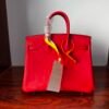 Birkin 25 Handcrafted Togo Leather in Ferrari Red with Silver Hardware Hand stitched Saddle stitch authentic hand-sewn sophisticated 12 Birkin 25 Handcrafted Togo Leather in Ferrari Red with Silver Hardware Hand stitched Saddle stitch authentic hand-sewn sophisticated