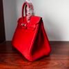 Birkin 25 Handcrafted Togo Leather in Ferrari Red with Silver Hardware Hand stitched Saddle stitch authentic hand-sewn sophisticated 13 Birkin 25 Handcrafted Togo Leather in Ferrari Red with Silver Hardware Hand stitched Saddle stitch authentic hand-sewn sophisticated