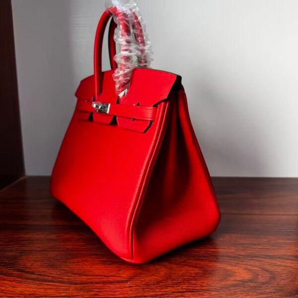 Birkin 25 Handcrafted Togo Leather in Ferrari Red with Silver Hardware Hand stitched Saddle stitch authentic hand-sewn sophisticated 3 Birkin 25 Handcrafted Togo Leather in Ferrari Red with Silver Hardware Hand stitched Saddle stitch authentic hand-sewn sophisticated
