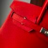 Birkin 25 Handcrafted Togo Leather in Ferrari Red with Silver Hardware Hand stitched Saddle stitch authentic hand-sewn sophisticated 15 Birkin 25 Handcrafted Togo Leather in Ferrari Red with Silver Hardware Hand stitched Saddle stitch authentic hand-sewn sophisticated