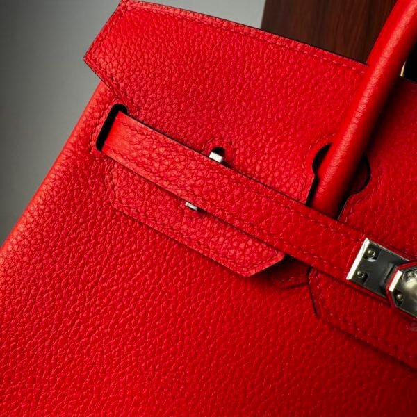 Birkin 25 Handcrafted Togo Leather in Ferrari Red with Silver Hardware Hand stitched Saddle stitch authentic hand-sewn sophisticated 5 Birkin 25 Handcrafted Togo Leather in Ferrari Red with Silver Hardware Hand stitched Saddle stitch authentic hand-sewn sophisticated